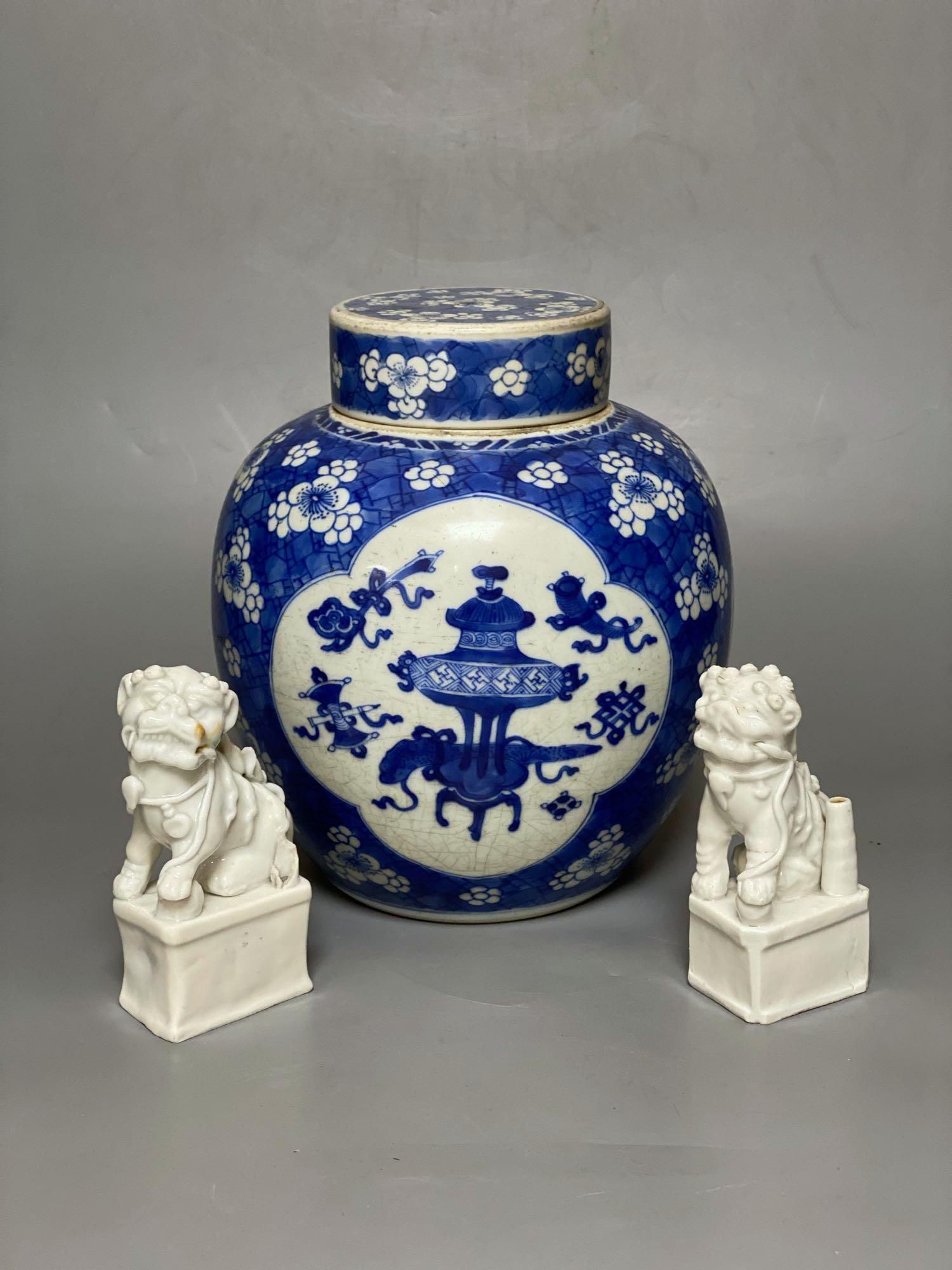 A Chinese blue and white ginger jar and cover, Kangxi period, 22.5cm and two blanc de chine dogs of fo